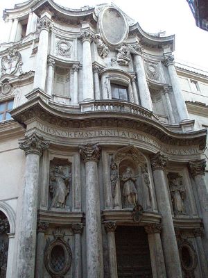 Imagen de San Carlino en Roma construida con ladrillos, también consta de una fachada secundaria y un pequeño campanario.
