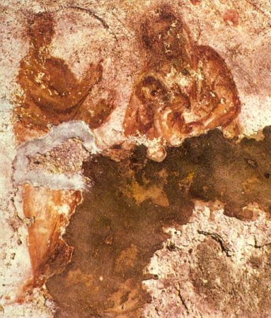 Una pintura rupestre de tres personas, incluida la Virgen y el niño.