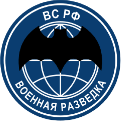 Un emblema con un murciélago negro superpuesto a un fondo azul.