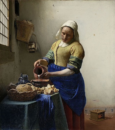 Pintura de Vermeer de una lechera sosteniendo una jarra
